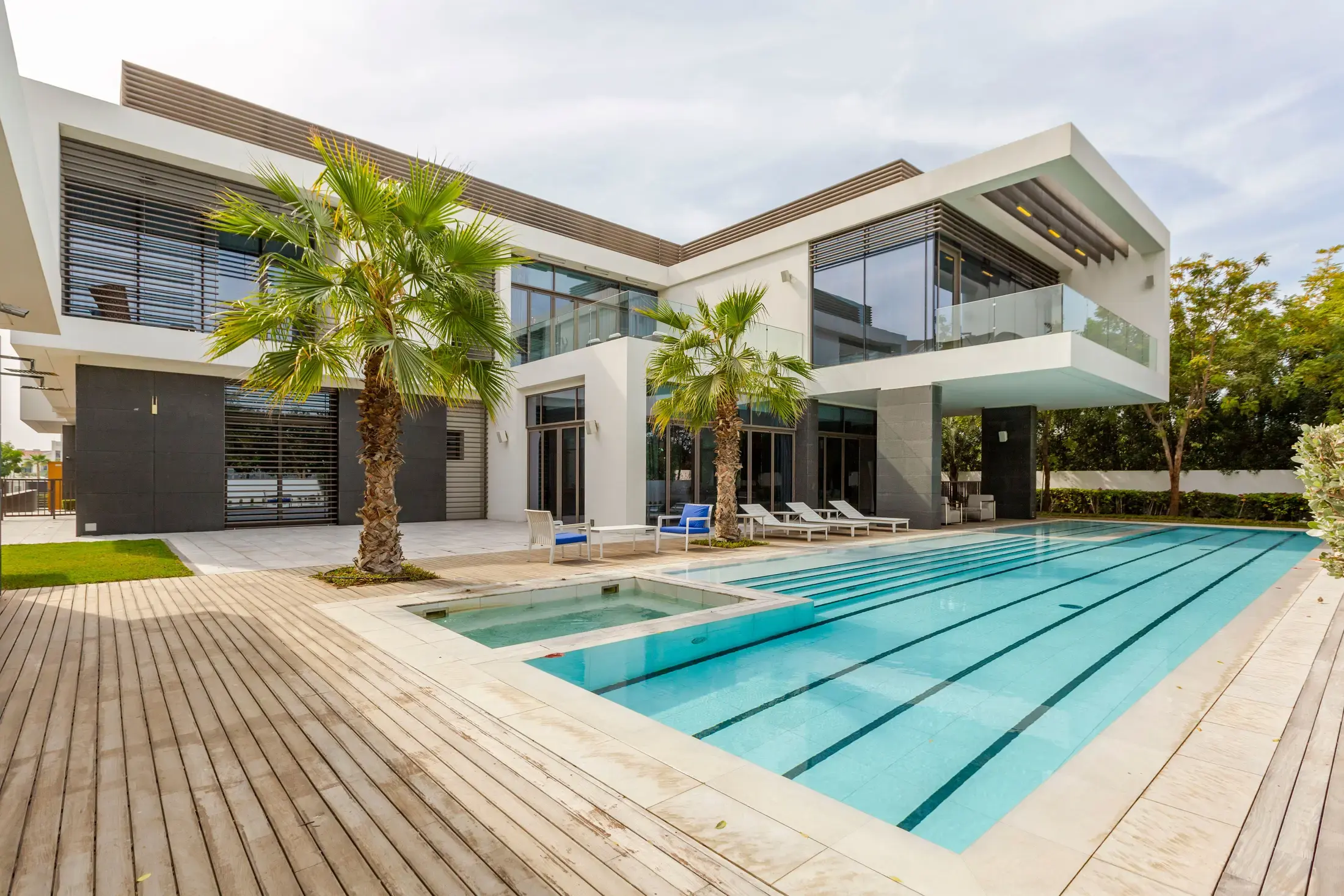 A contemporary villa with a lap pool and a timber terrace