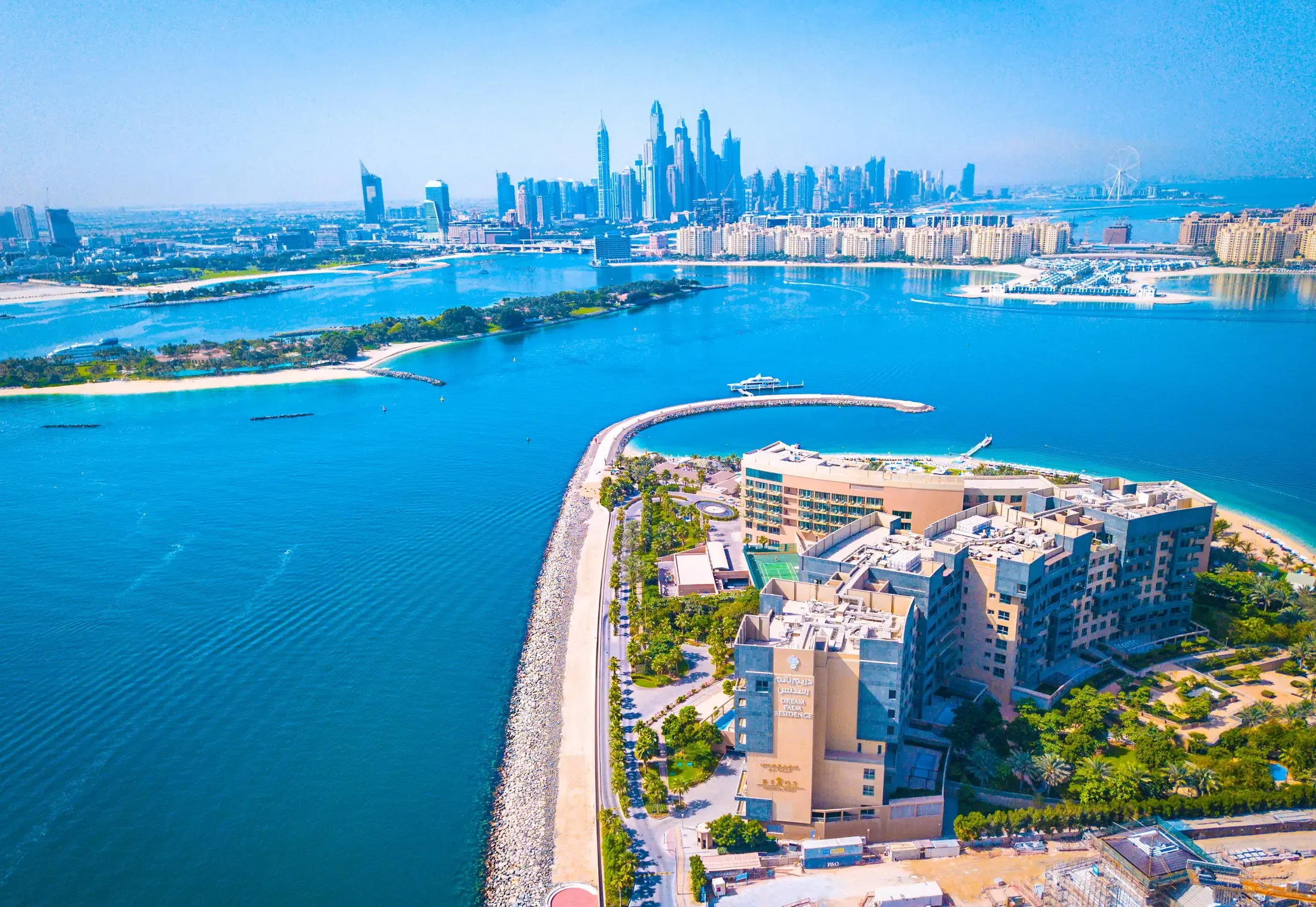 The Palm Jumeirah crescent, with the Dubai Marina skyline across the water