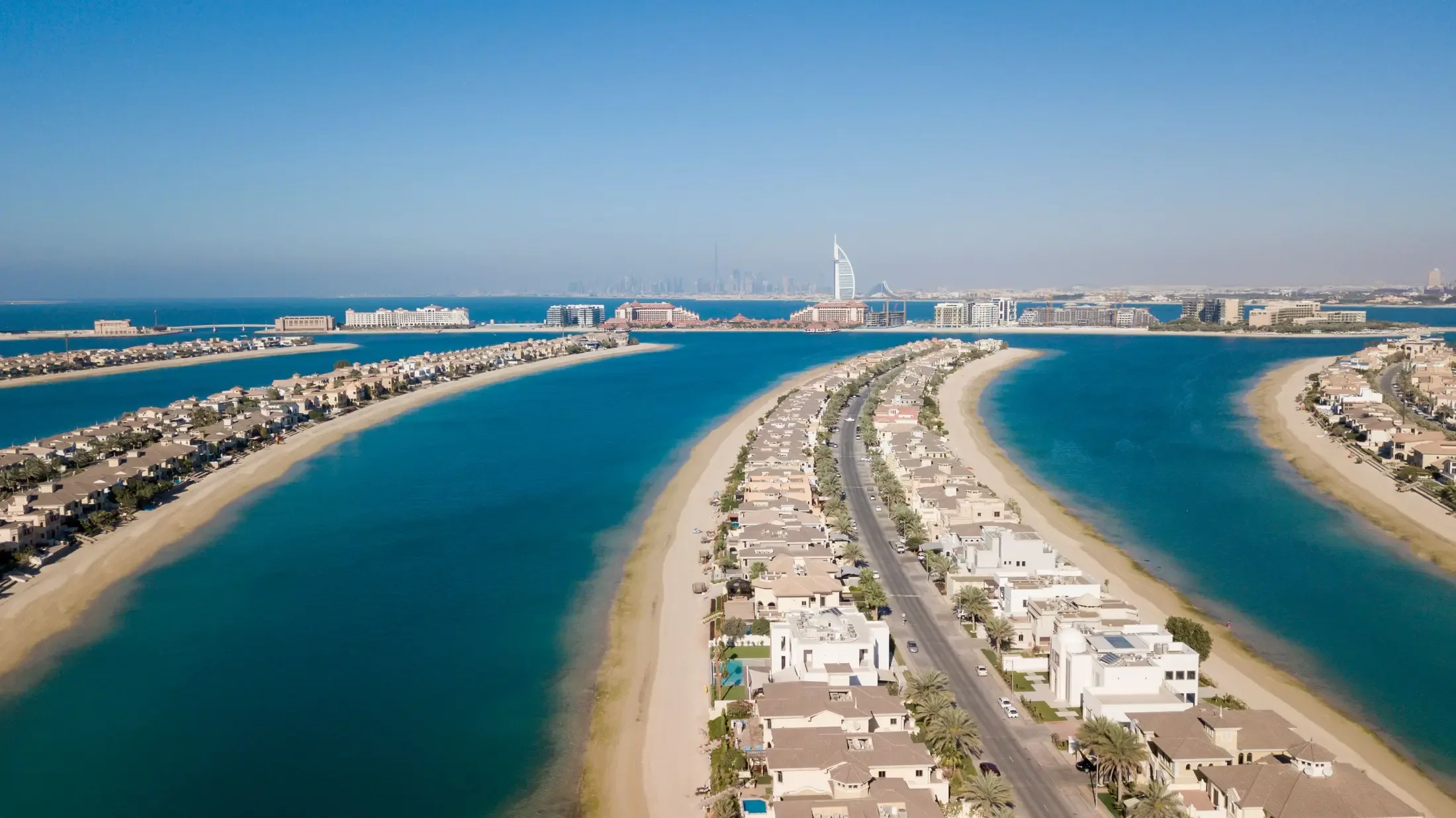Palm Jumeirah from the air, its fronds reaching into the Gulf
